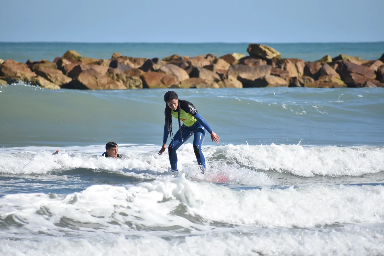 Valeria surfing on her day off